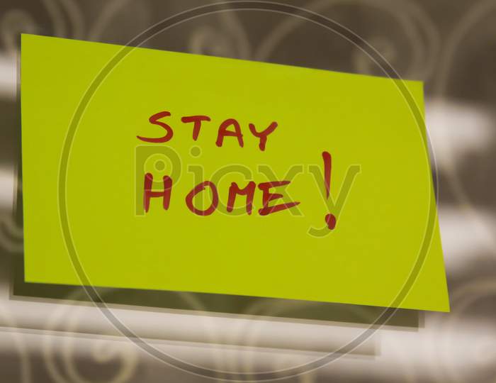 Sticky Note On Window With Stay Home Writing Text Message