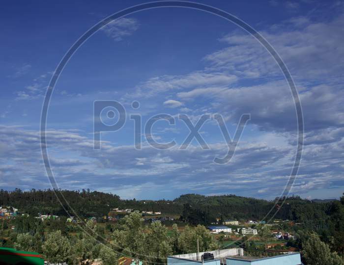 Blue sky with white clouds in the hills