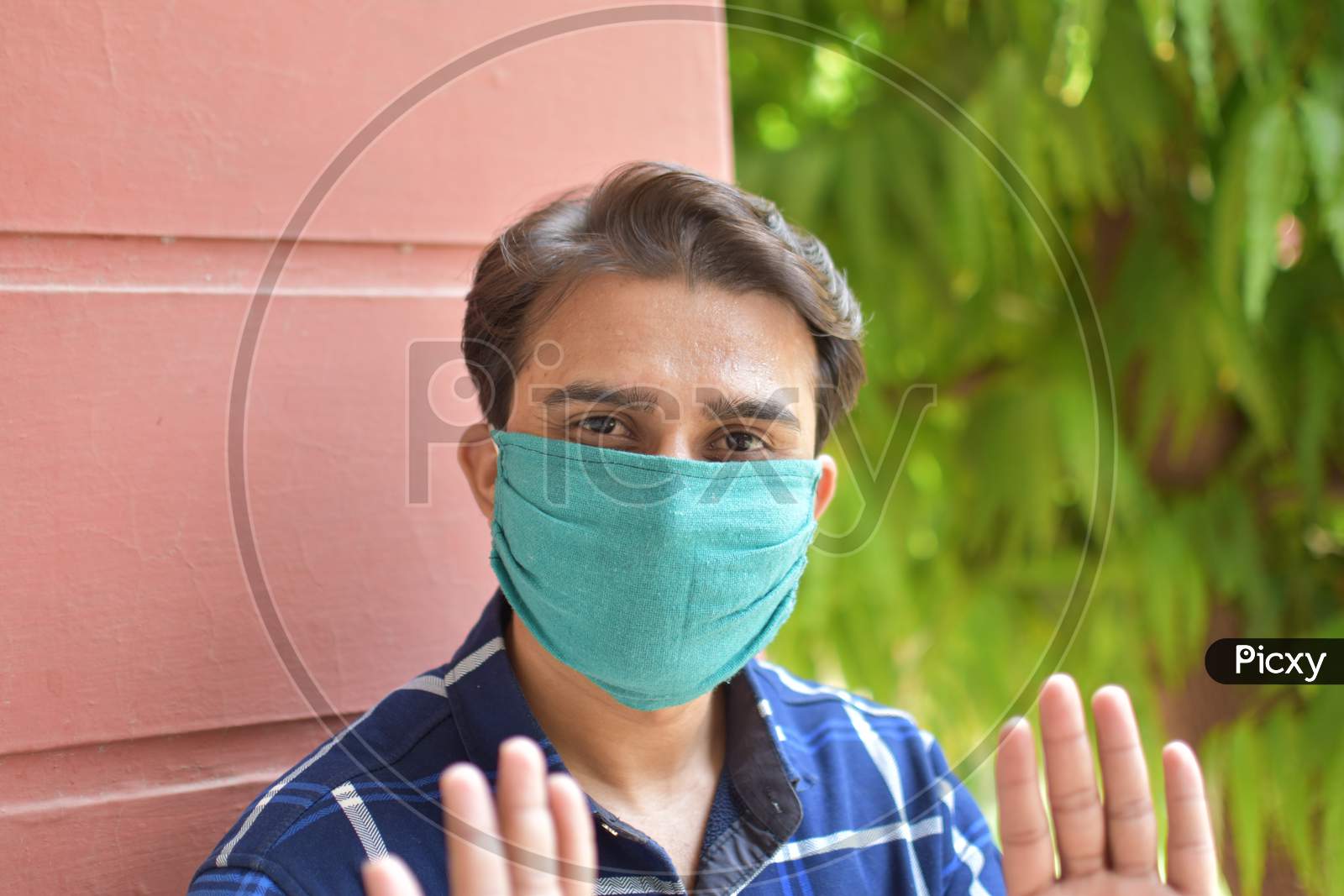 indian student with green mask on face