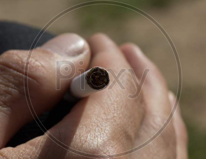 Holding A Cigarette In Man Hand