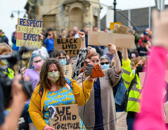 Blm Protesters Wear Ppe Face Masks And Hold Homemade Signs At A Black Lives Matter Protest In Richmond, North Yorkshire