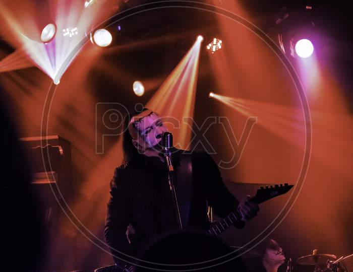 Krakow, Poland - September 20, 2014: An Artist Playing Guitar In An Open Rock Band Music Concert Performance