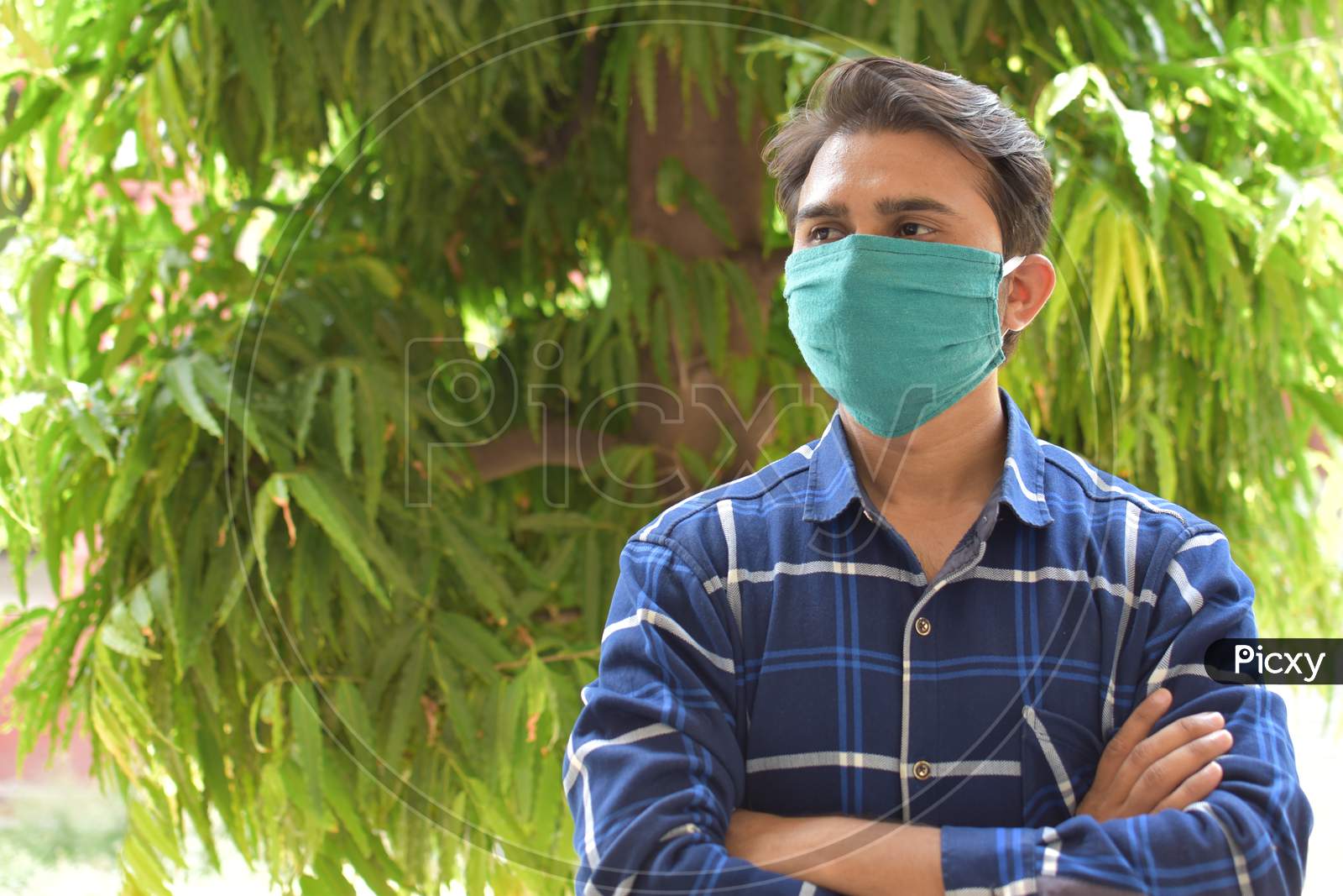 indian man with green mask on face