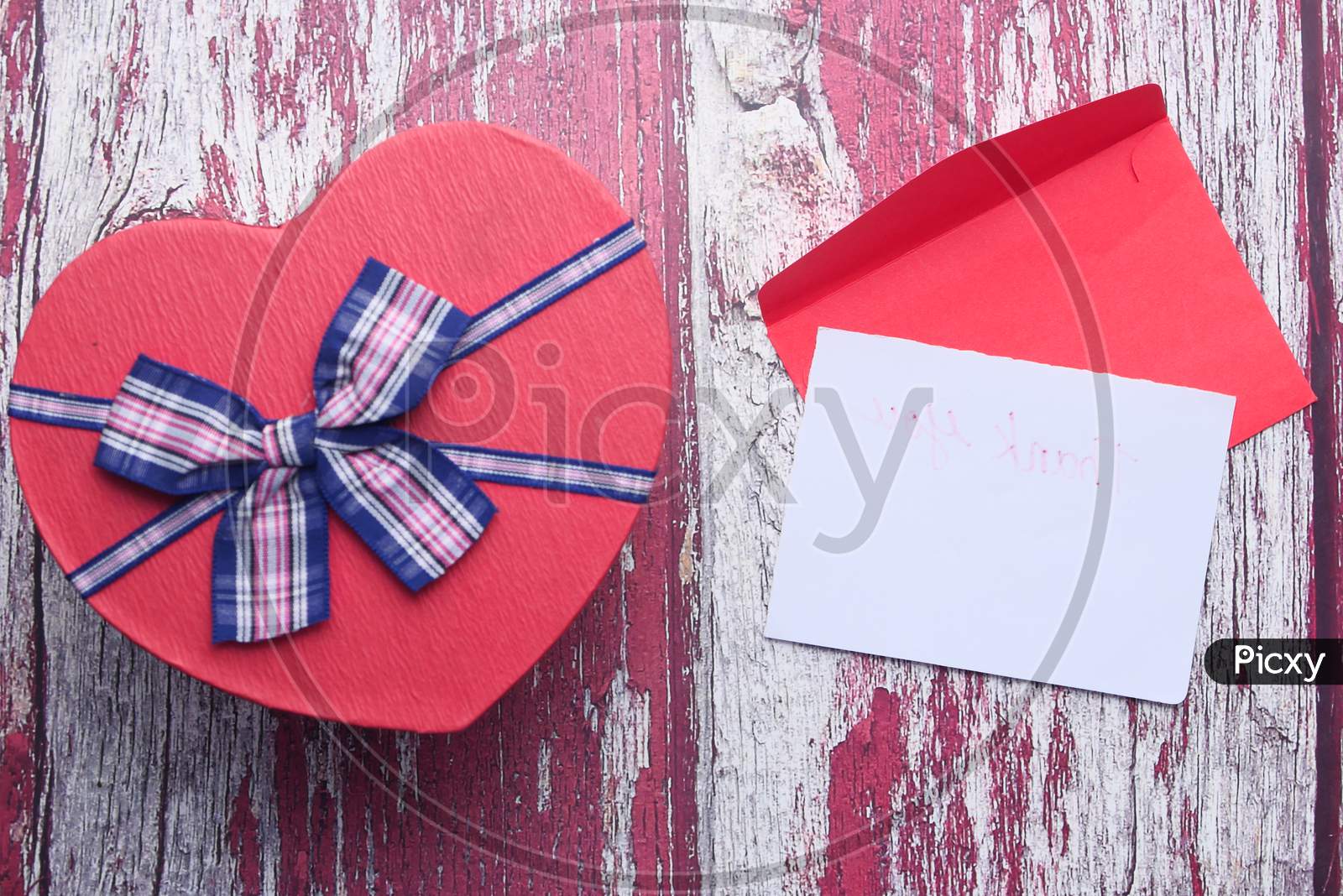 Heart Shape Gift Box And Envelope On Table
