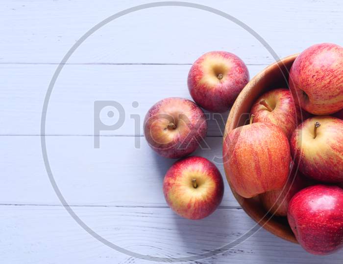 Close Up Of Fresh Apple In A Bowl On Wooden Table