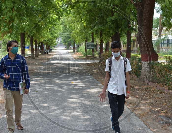 indian college student in campus with mask