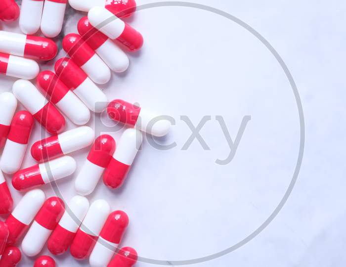 Close Up Of Colorful Capsules On White Background