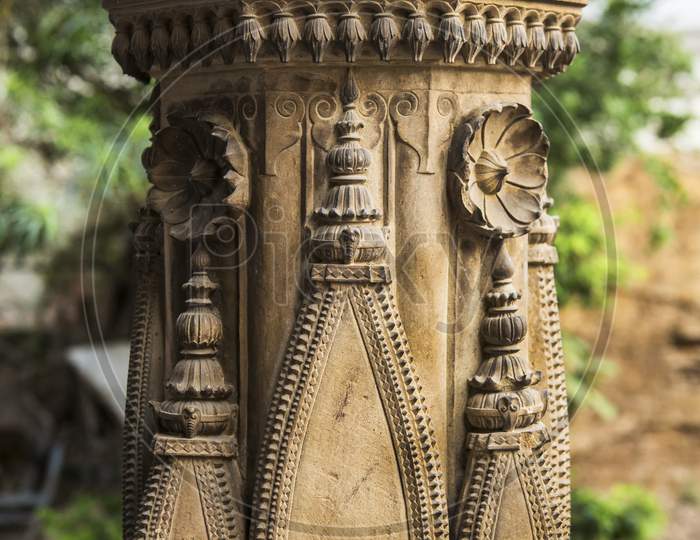 Around Two Century Old Stone Curving In A Temple Pillar