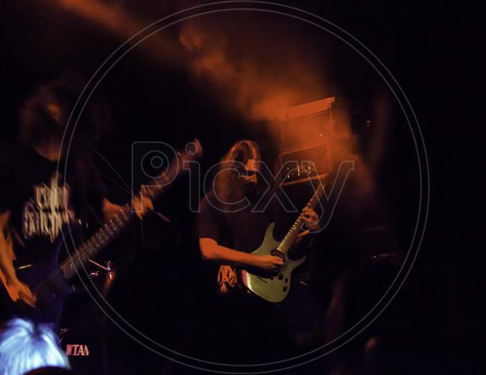 Krakow, Poland - September 20, 2014: Two Artists Playing Guitar In A Rock Band Music Concert Performance