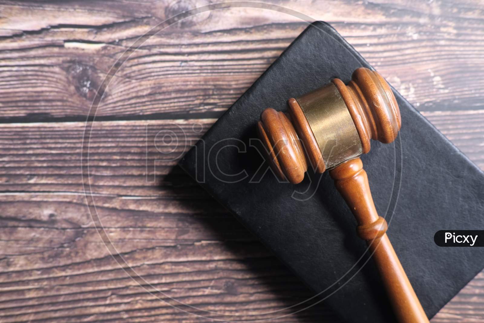 Top View Of Gavel On A Book On Table