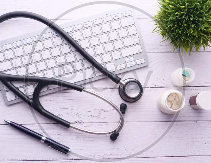 Medical Stethoscope And Keyboard On Black Background