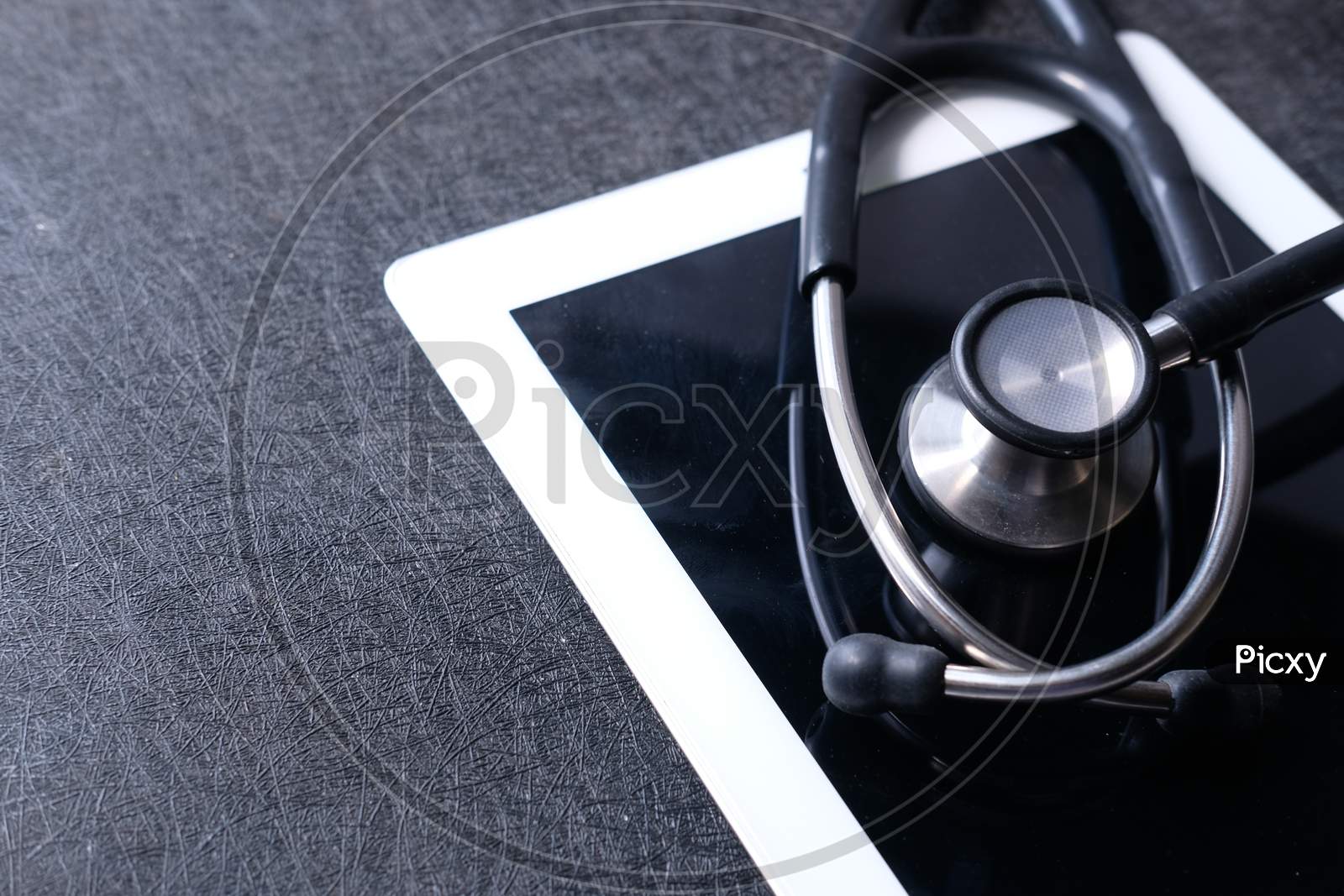 Medical Stethoscope On Modern Digital Tablet On White Background