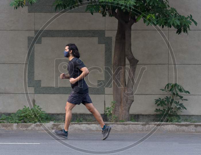 A Man Running Wearing Mask.
