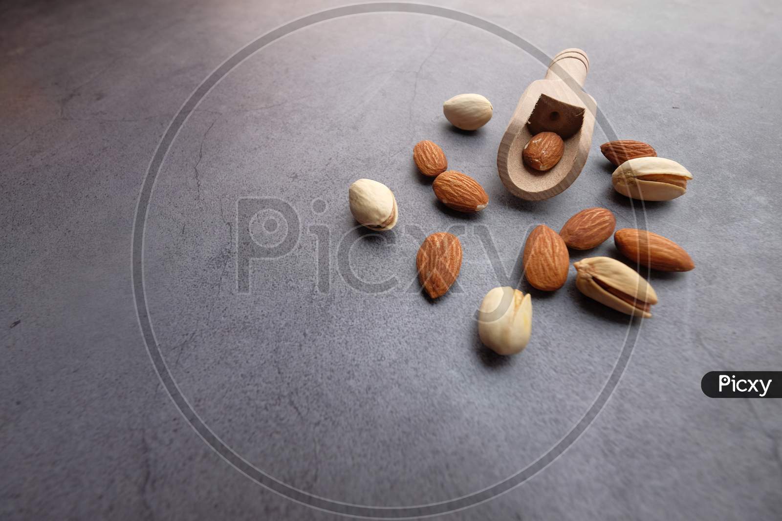 Almond And Pistachios Nut On Gray Background