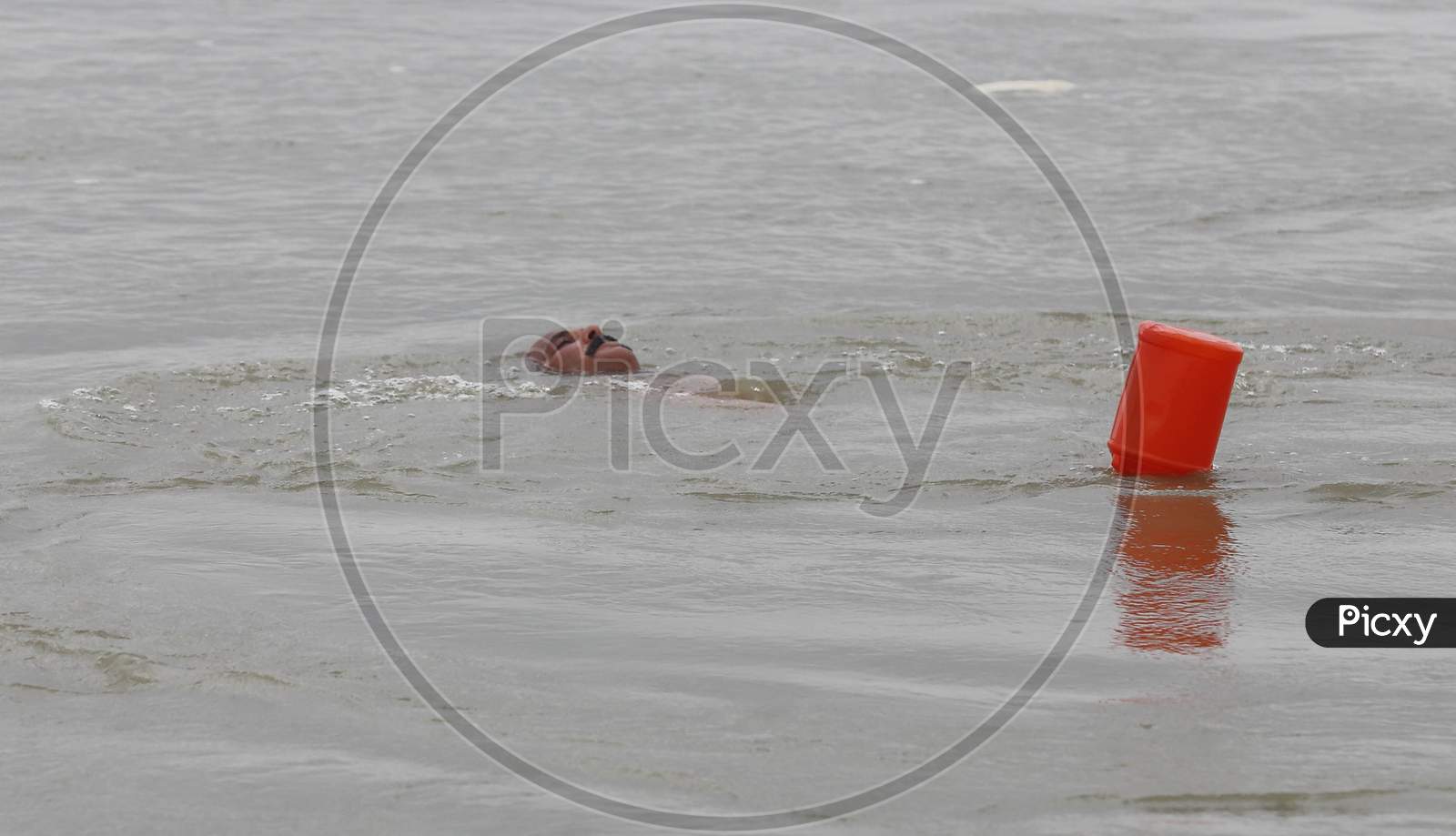 A Man Performs Water Yoga In The Ganga River ahead of International Yoga Day In Prayagraj, June 14, 2020.