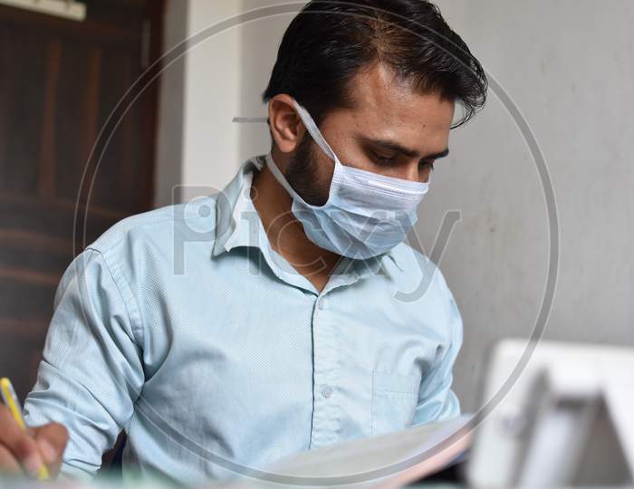 indian student doing self study in home