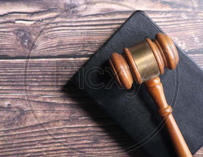 Top View Of Gavel On A Book On Table