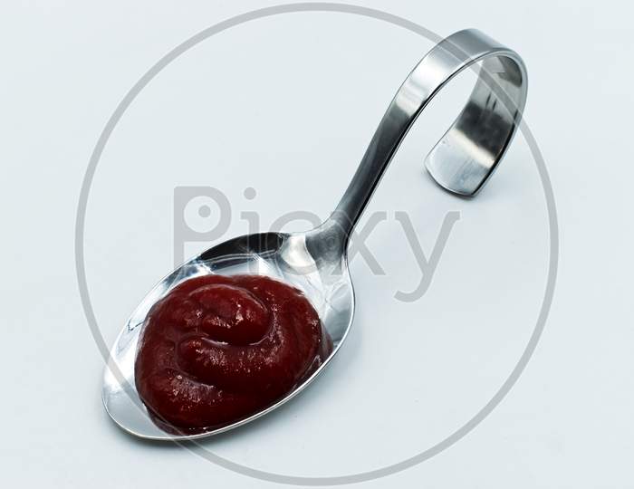 Fresh ketchup isolated on white background