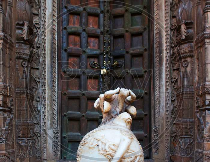 Holy Bull Nandi Sitting Out Side Of A Shiva Temple, Varanasi