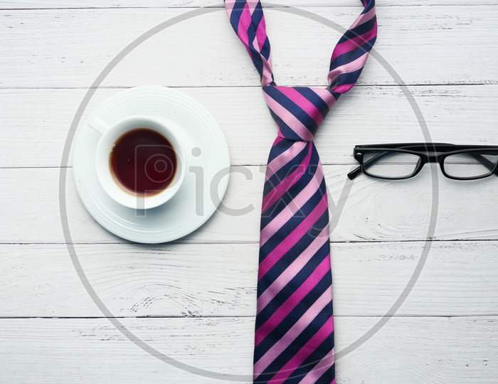 Father'S Day Concept. Men'S Tie, Glasses, Coffee On White Background Top-Down.