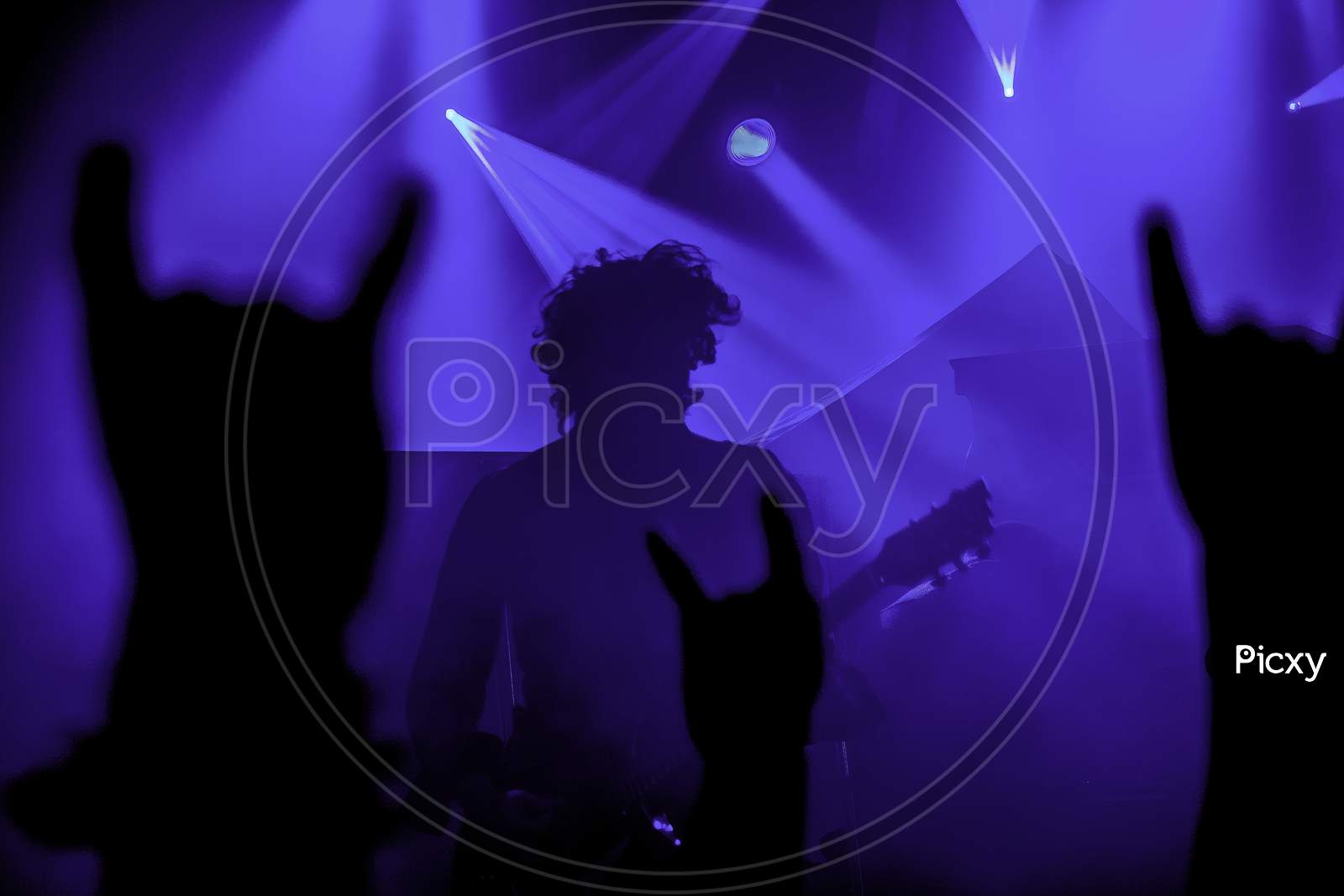 Krakow, Poland - September 20, 2014: Abstract Background Image Of An Artist From A Rock Band Music Concert In Front Of Crowd