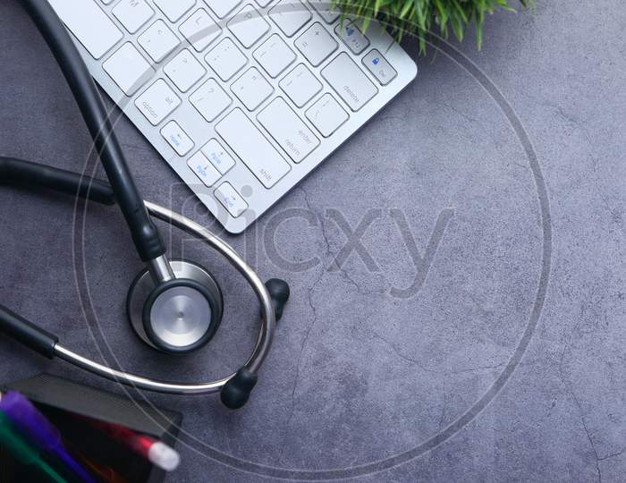 Medical Stethoscope And Keyboard On Black Background