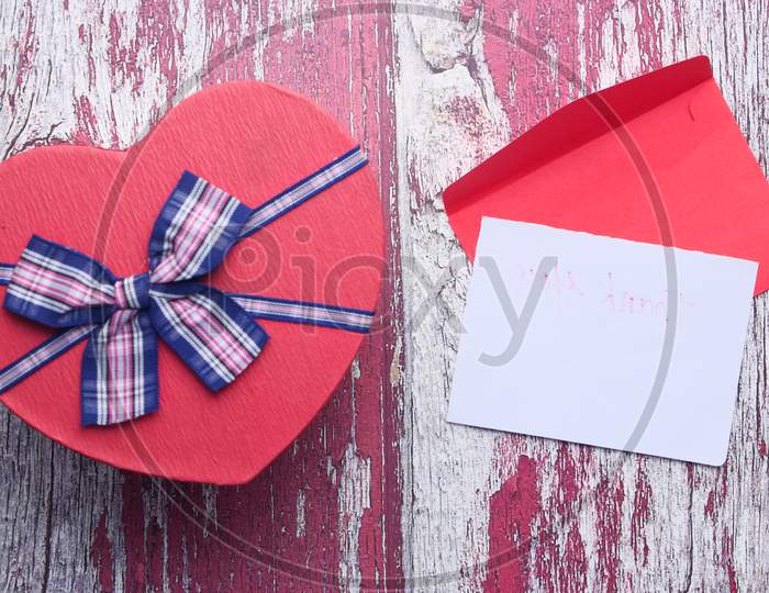 Heart Shape Gift Box And Envelope On Table
