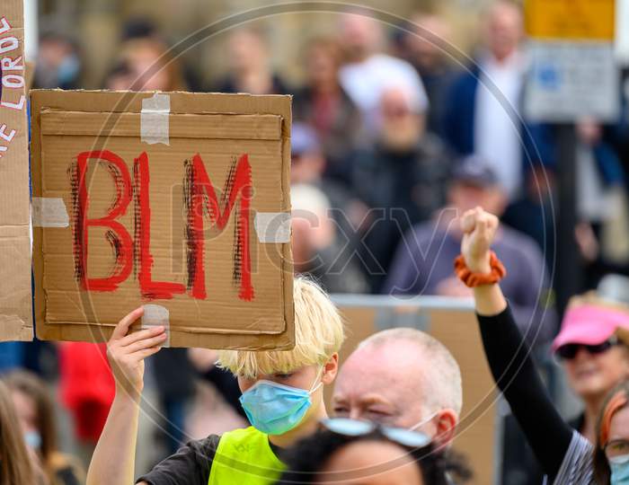 A Protester Wears A Ppe Face Mask And Holds A Homemade Blm Sign Up High At A Black Lives Matter Protest