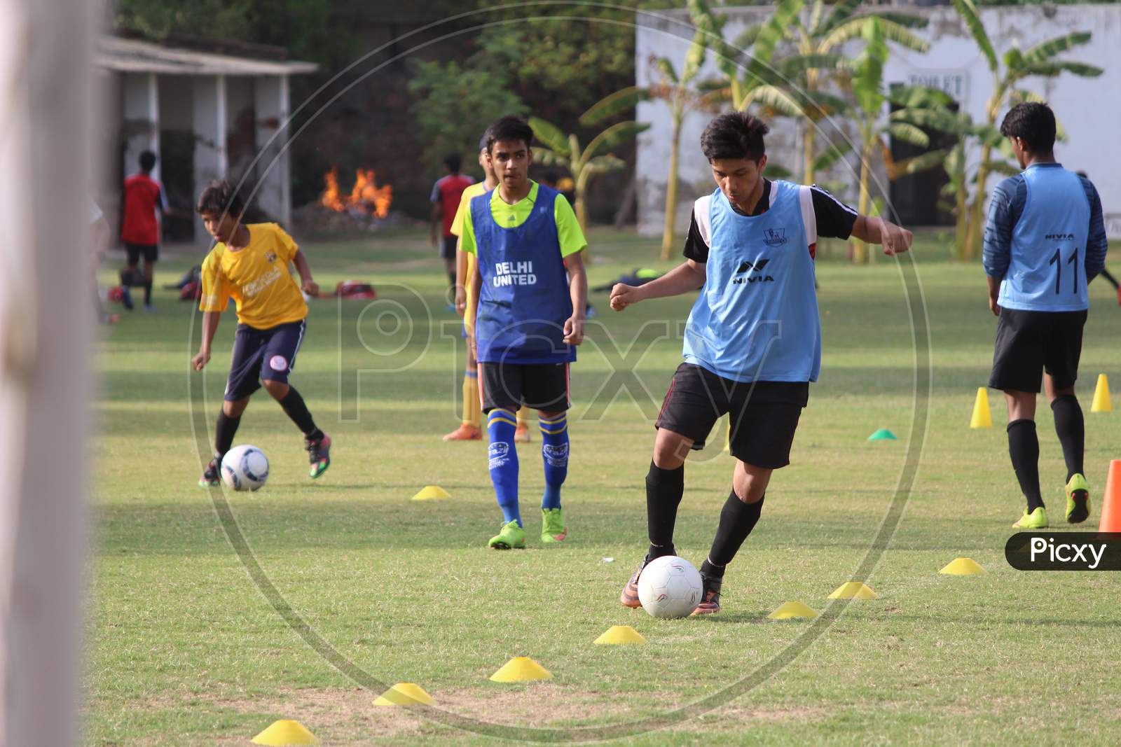 New Delhi, Delhi/ India- June 15 2020: Young Boys Playing Football In The Green Fields, After The Lockdown Gets Over In New Delhi.