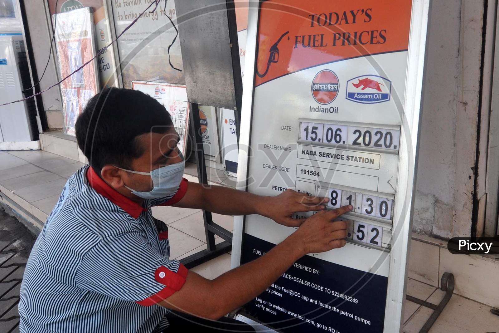 A Fuel Station Attendant Fills Out The Revised Prices On Board, In Guwahati , Tuesday,15 June 2020.