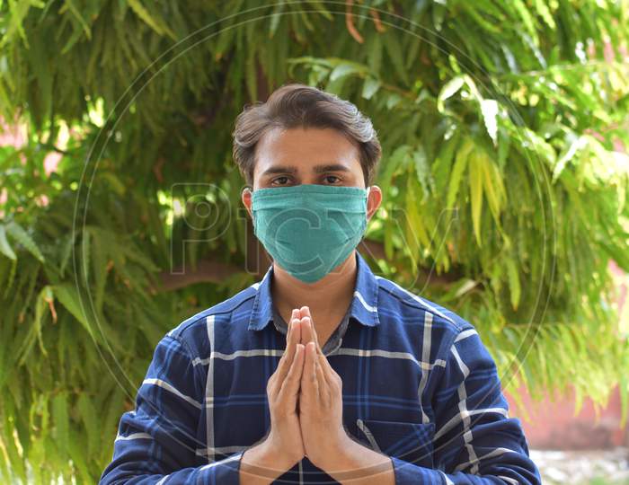 indian man with green mask on face