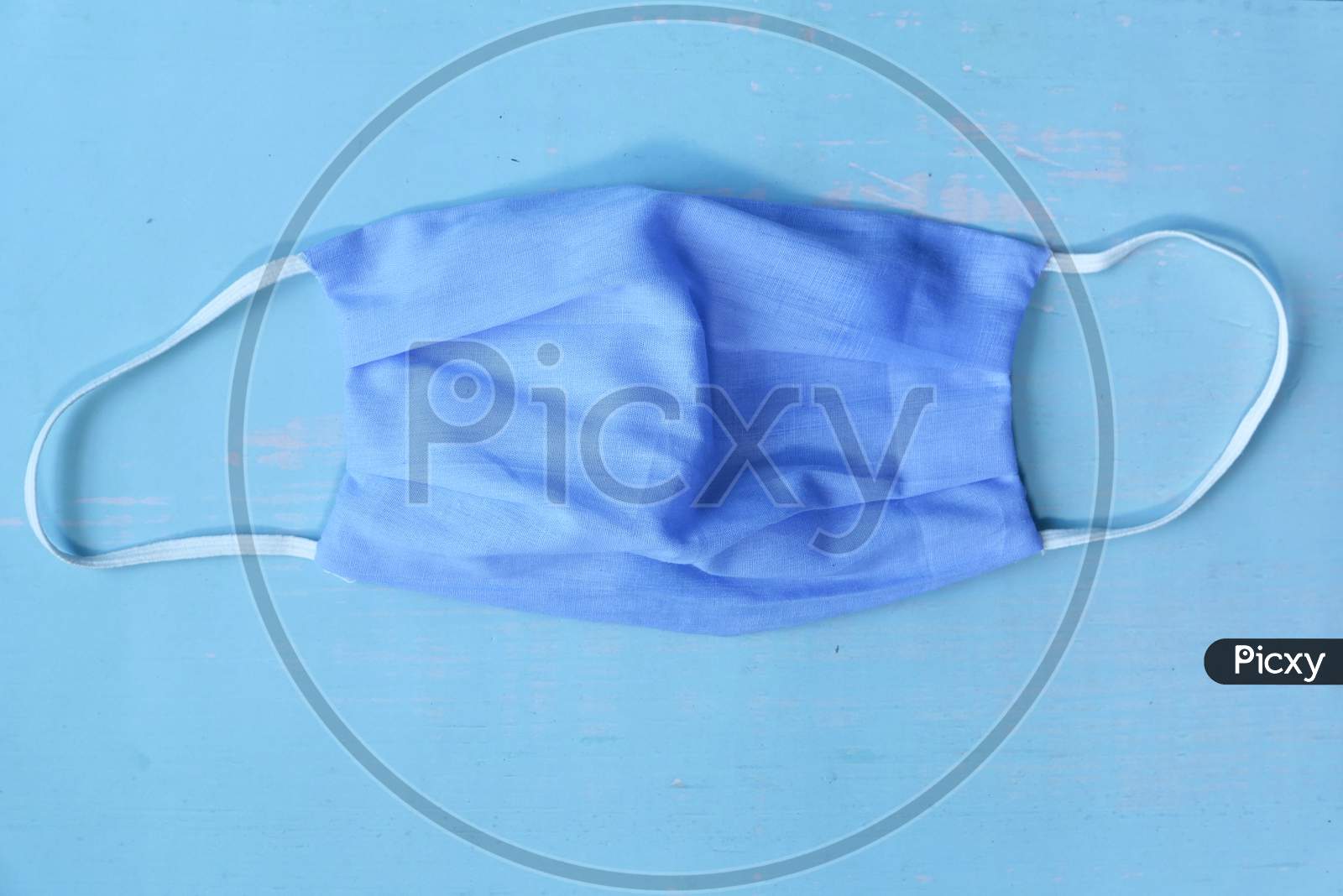 Blue Color Homemade Face Mask On Wooden Background