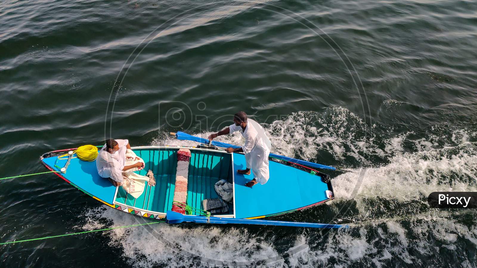 Egyptian Boys Selling Handmade Cloth While Sailing On Boat.