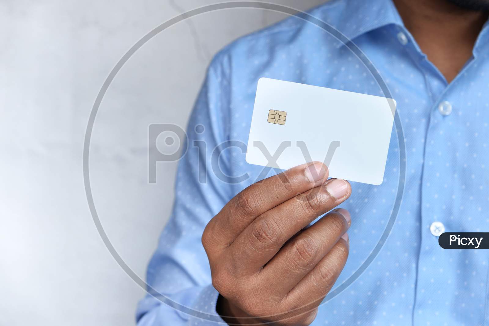 Man In Casual Dress Showing Credit Card