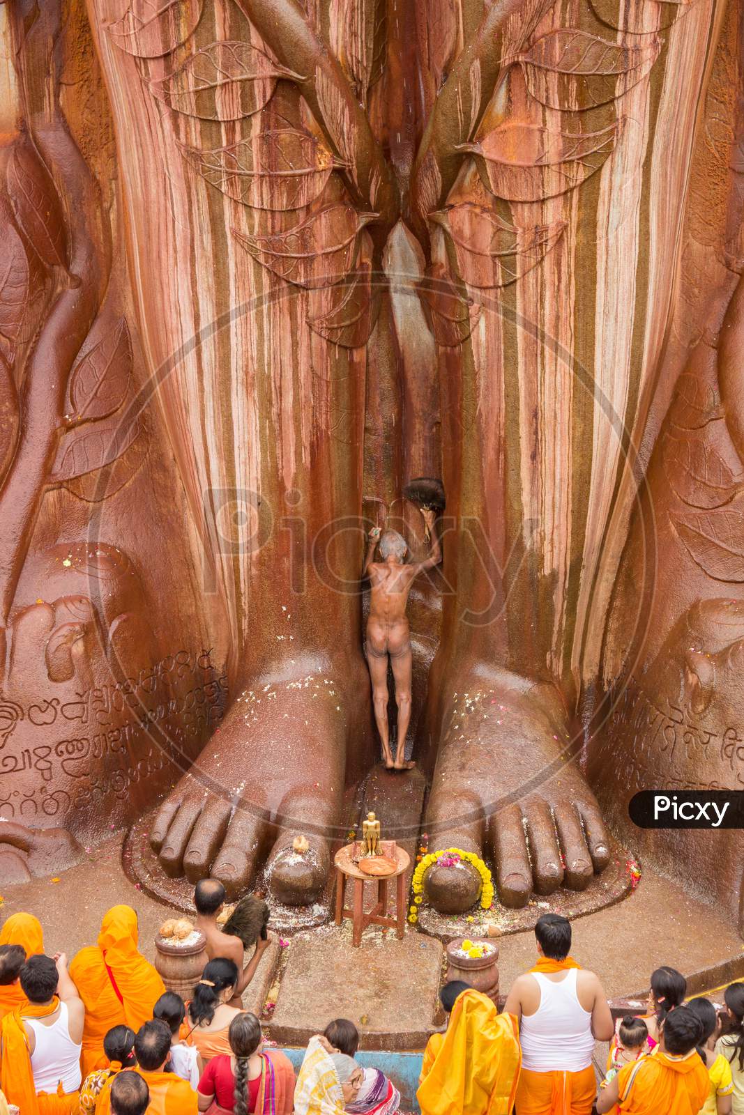 A Jain Monk praying to the Mammoth Bahubali Statue at Shravanabelagola/India.