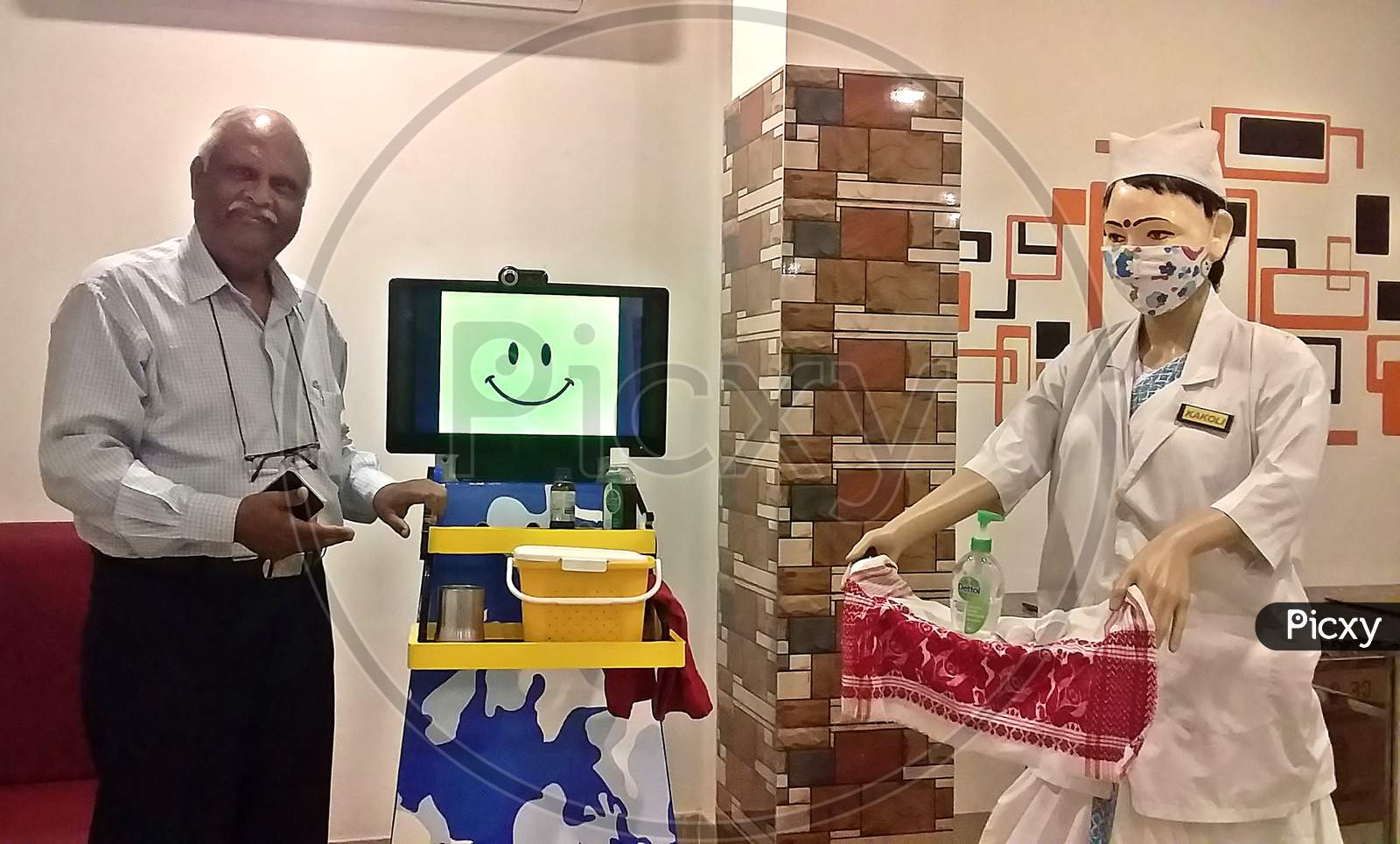 Assam Based Innovator SN Farid During A Demonstration Of robots which serve food and medicine to Covid-19 patients and facilitate virtual meeting with doctors, In Guwahati ,India