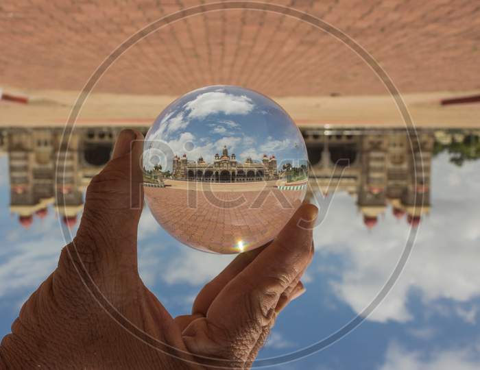 An artistic view of Mysore Ambavilas palace through the Crystal Ball in Karnataka/India.