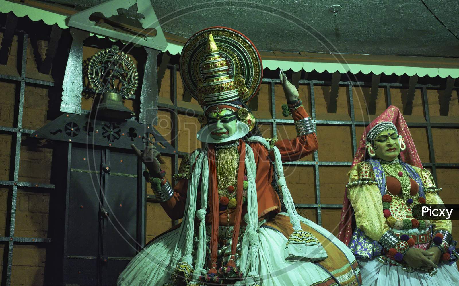 Kochi, India - March 15, 2014: An Indian Classical Dance Form Named Kathakali Artists Tells Indian Mythological Stories Through Numerous Gestures Techniques And Emotions In Front Of European Tourists.