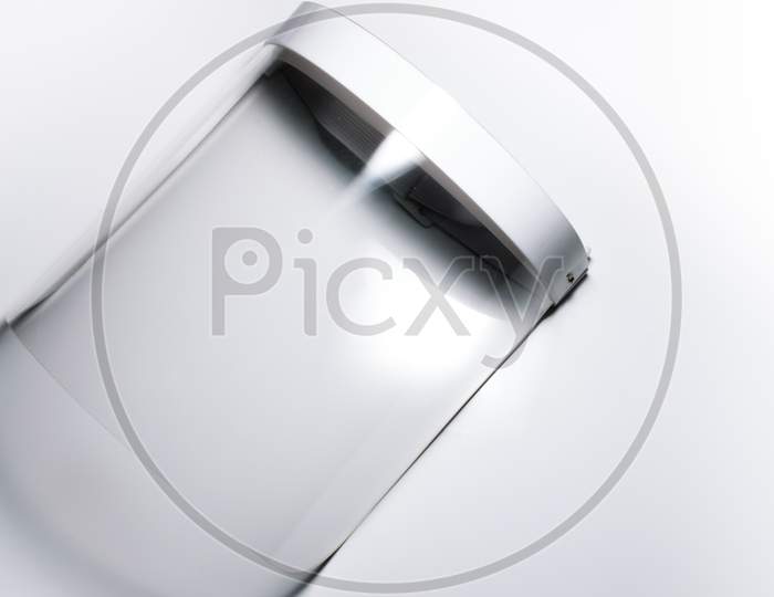 An Isolated Face Shield For Protection Against Covid 19 In A White Background