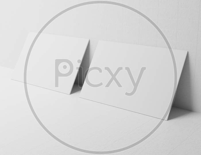White Business Card Paper Mockup Lean On Wall Template With Blank Space Cover For Insert Company Logo Or Personal Identity On Cardboard Background. Modern Stationary Concept. 3D Illustration Render