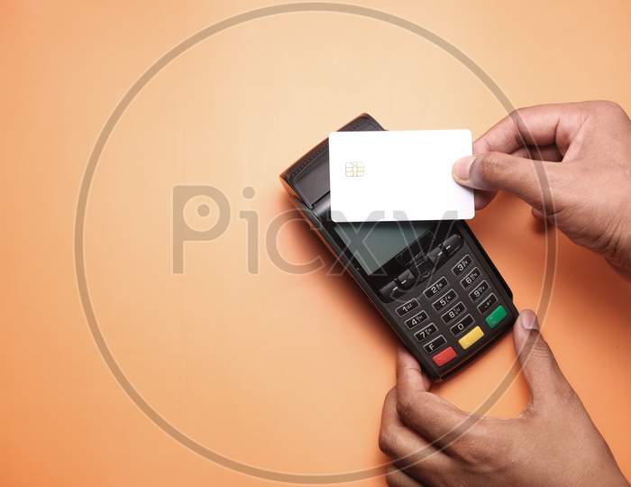 Payment Terminal Charging From A Card, Contactless Payment.