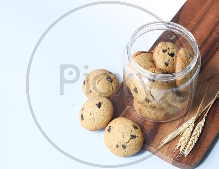 Jar Full Of Chocolate Chip Cookies On White Background