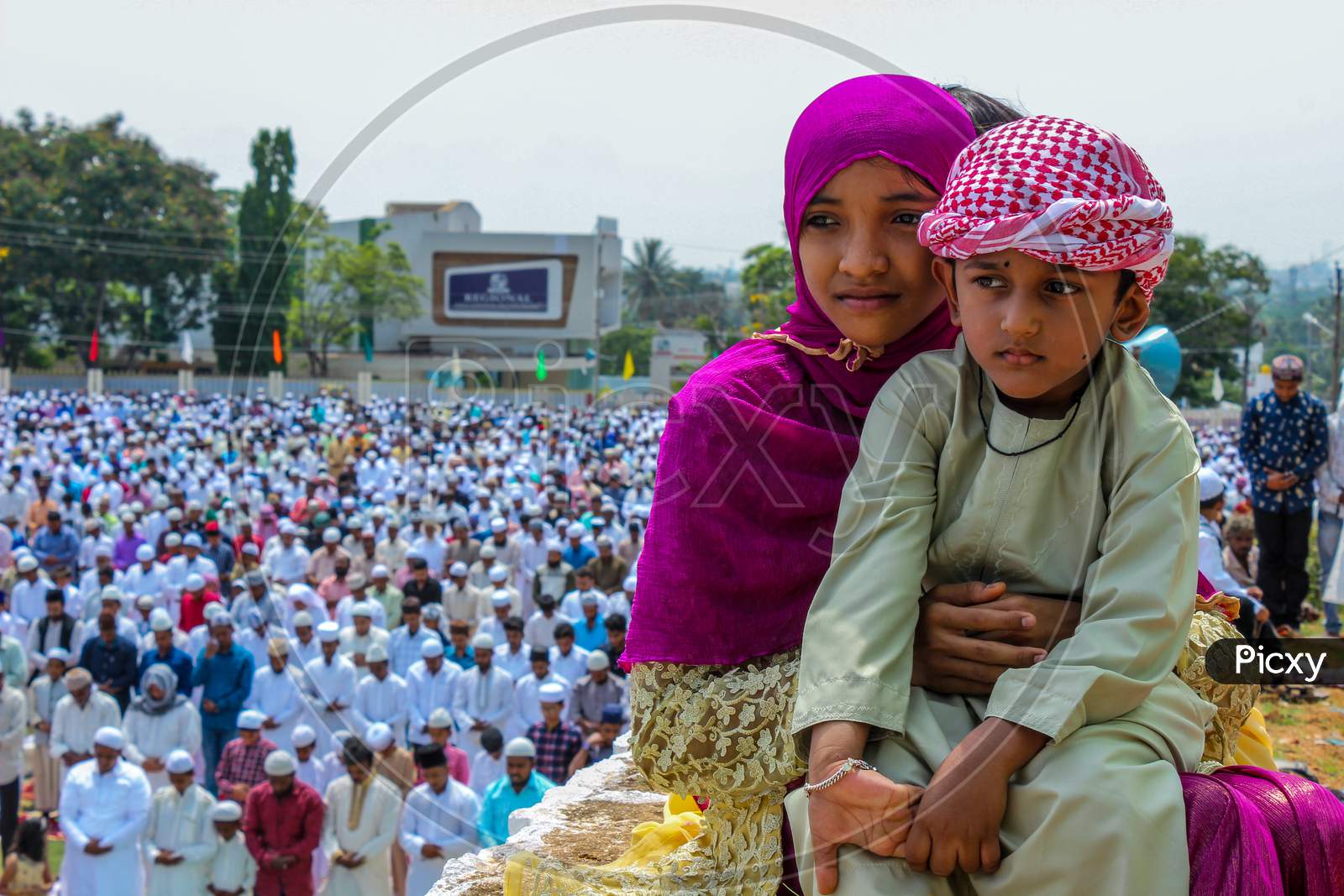 A Sister and her brother sitting at a Ramadan gathering in Mysore/Karnataka/India.