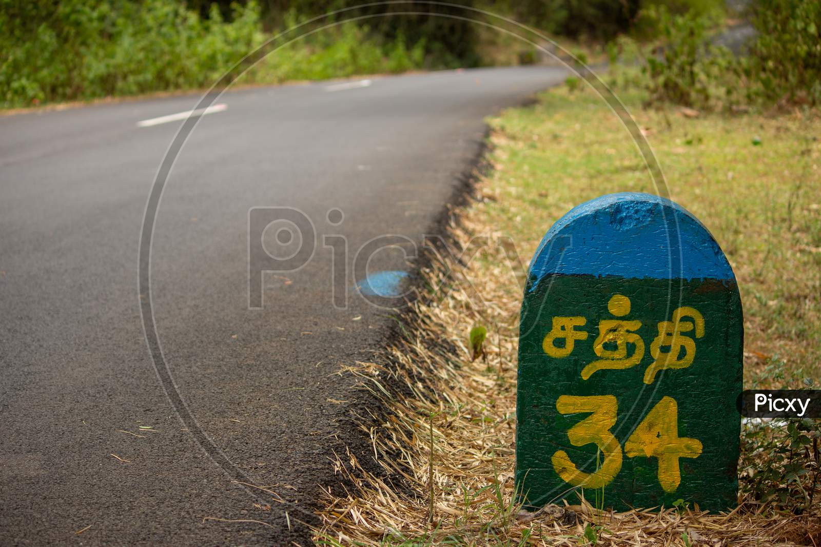 Beautiful Ghat Road With Milestone Indicating Distance To Sathyamangalam (In Tamil) Along The Mountain Range Of Talamalai Reserve Forest, Hasanur, Tamil Nadu - Karnataka State Border, India