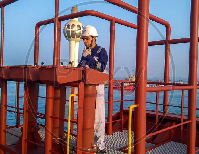 Seafarer operating and communicating during a Ship approach to port.