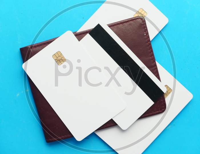Close Up Of Credit Cards On Wallet On Blue Background
