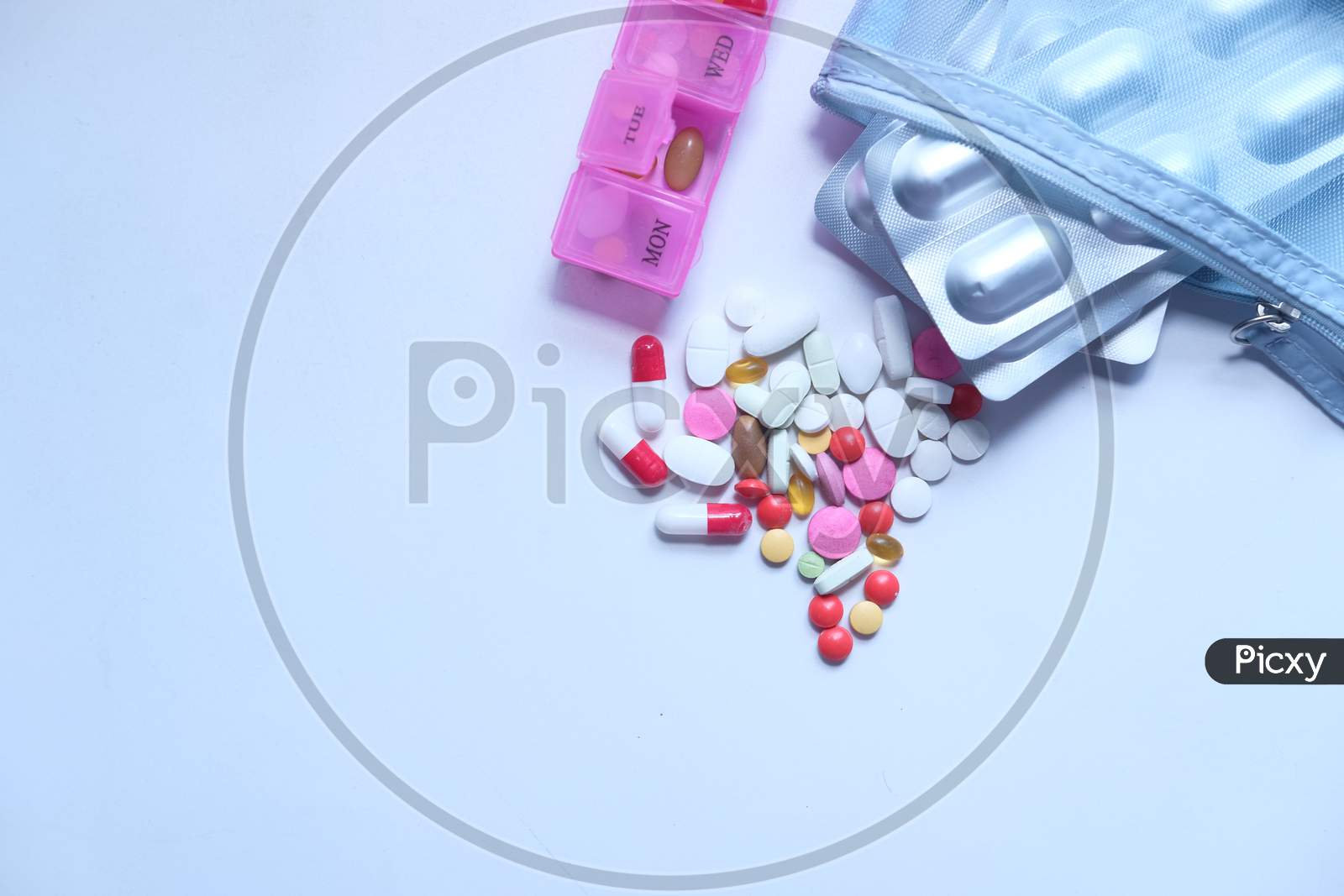 High Angle View Of Colorful Pills On White Background