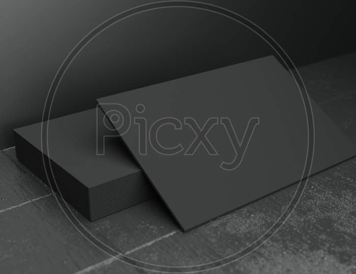 Black Horizontal Business Card Paper Mockup Template With Blank Space Cover For Insert Company Logo Or Personal Identity On Black Concrete Floor Background. Modern Concept. 3D Illustration Render