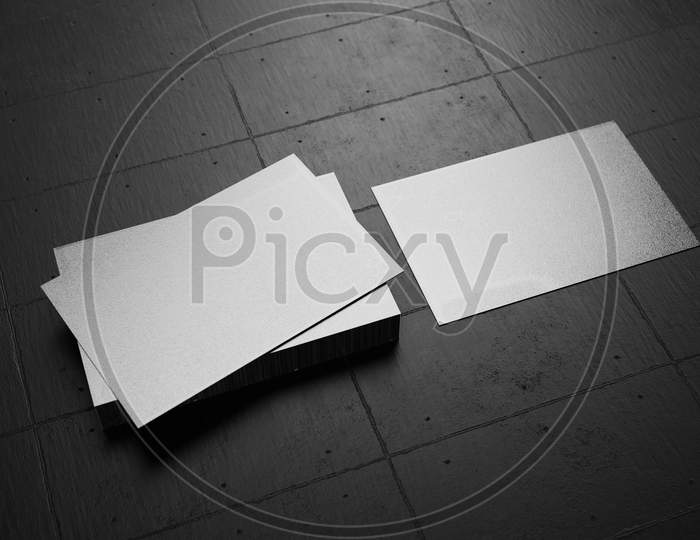 White Horizontal Business Card Paper Mockup Template With Blank Space Cover For Insert Company Logo Or Personal Identity On Black Cardboard Floor Background. Modern Concept. 3D Illustration Render