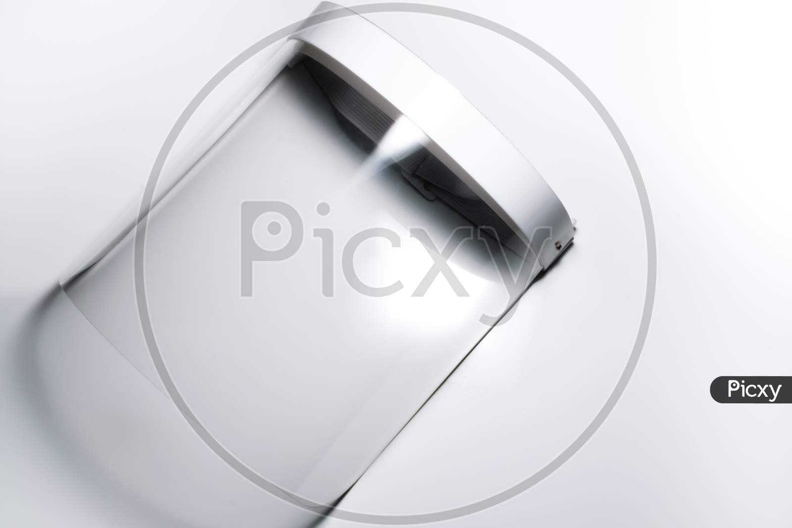 An Isolated Face Shield For Protection Against Covid 19 In A White Background